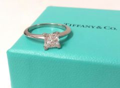 Tiffany, a fine diamond solitaire ring, set in platinum, the square shaped diamond assessed as VS1