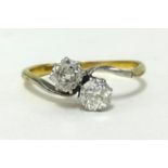 An 18ct diamond crossover ring, set with two old cut diamonds, weighing approx .50 carats in