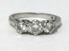 A platinum 3 stone diamond ring, finger size L approx weight 4.7gms.