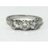 A platinum 3 stone diamond ring, finger size L approx weight 4.7gms.