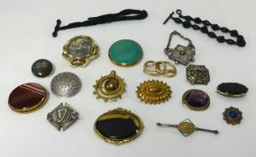 Sixteen decorative brooches / pendants (Ruskin pinchbeck etc), also a jet and silk watch chain,