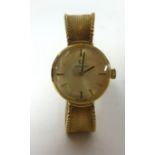 Omega, a 9ct gold ladies wristwatch with gold milanese bracelet, stamped .375, approx 22.70gms.