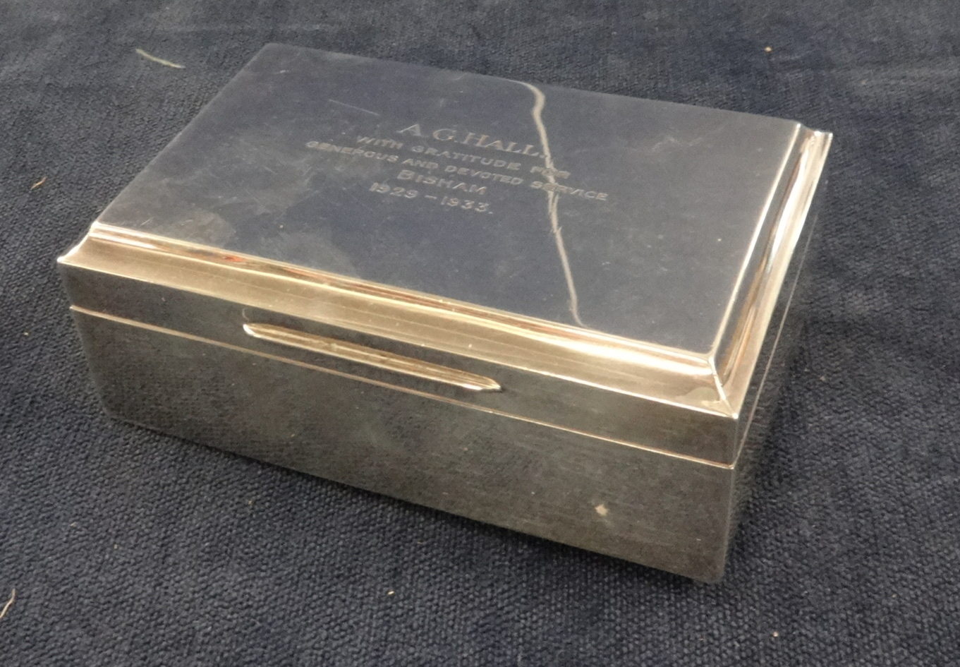 A rectangular silver cigarette box, London.