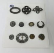 Various antique brooches including seven cut steel brooches also a buckle and three buttons.