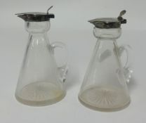 Asprey, two silver mounted glass whisky tots (2).