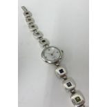 A boxed ladies silver wristwatch and stone set bracelet.