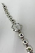 A boxed ladies silver wristwatch and stone set bracelet.