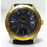 Rolex, Oyster Perpetual Datejust, a gents steel and gold wristwatch with blue dial and gold bezel.