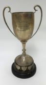 A silver twin handle trophy with inscription 'Devon Junior League, Tavistock', approx 270gms.