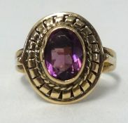 A 9ct gold ring set with amethyst, finger size L.