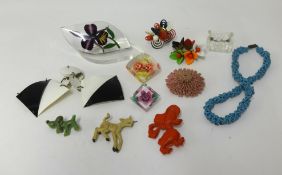 A collection of Lucite plastic jewellery.