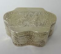 A silver box of wavy edge outline embossed with scrollwork and figures, circa 1895, approx 71.4gms.