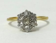 An 18ct diamond cluster ring, size S