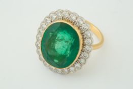 A fine and large emerald and diamond cluster ring, approx emerald weight 13.84ct, approx diamond