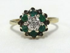 A 9ct gold cluster ring with emerald and diamond, size M1/2