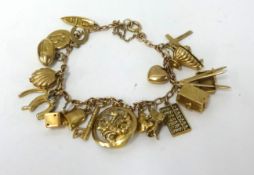 A 9ct gold charm bracelet, approx 27.9gms.