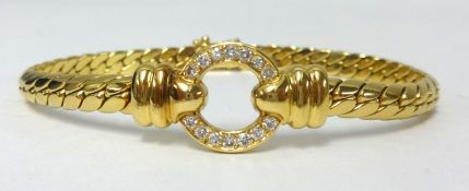 An 18ct yellow gold bracelet set with a circle of diamonds, approx 30gms.