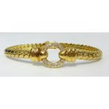 An 18ct yellow gold bracelet set with a circle of diamonds, approx 30gms.