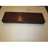 Mahogany gun case with brass corners and inset brass roundel, the interior compartmented and lined