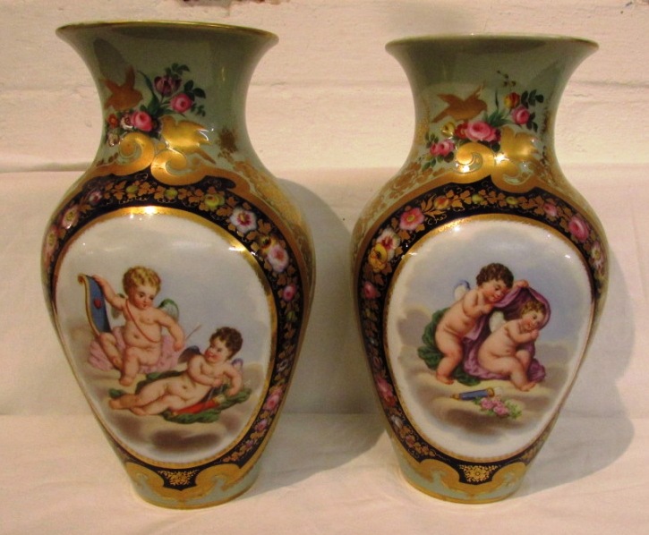 A pair of continental porcelain baluster vases, celadon ground and painted and transfer decorated to