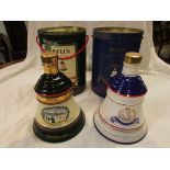 Two Bell's Scotch whisky Wade porcelain decanters, one for Christmas 1989, the other to