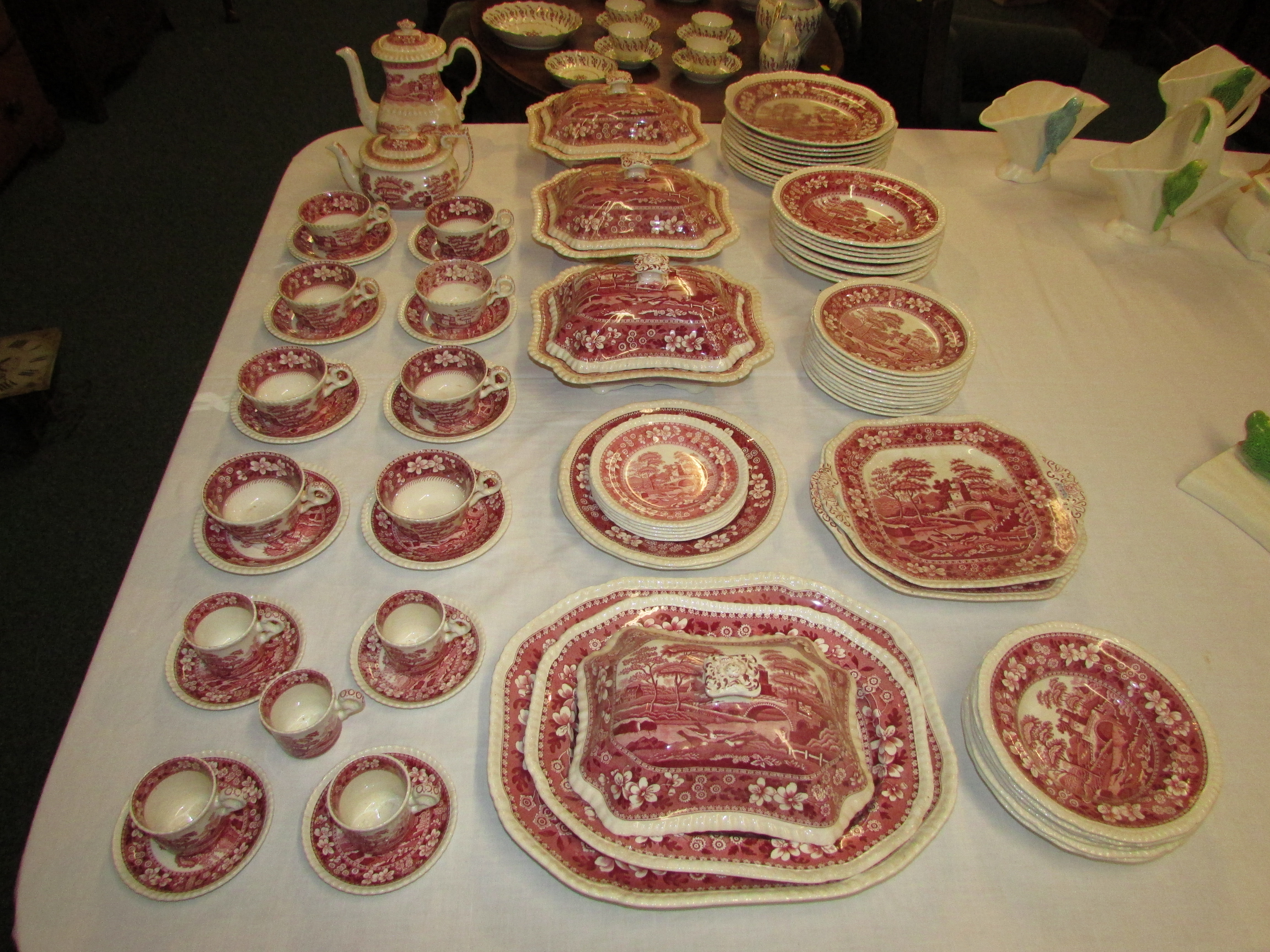 A large selection of Spode dinner and coffee ware in 'Pink Tower' pattern, the components of various