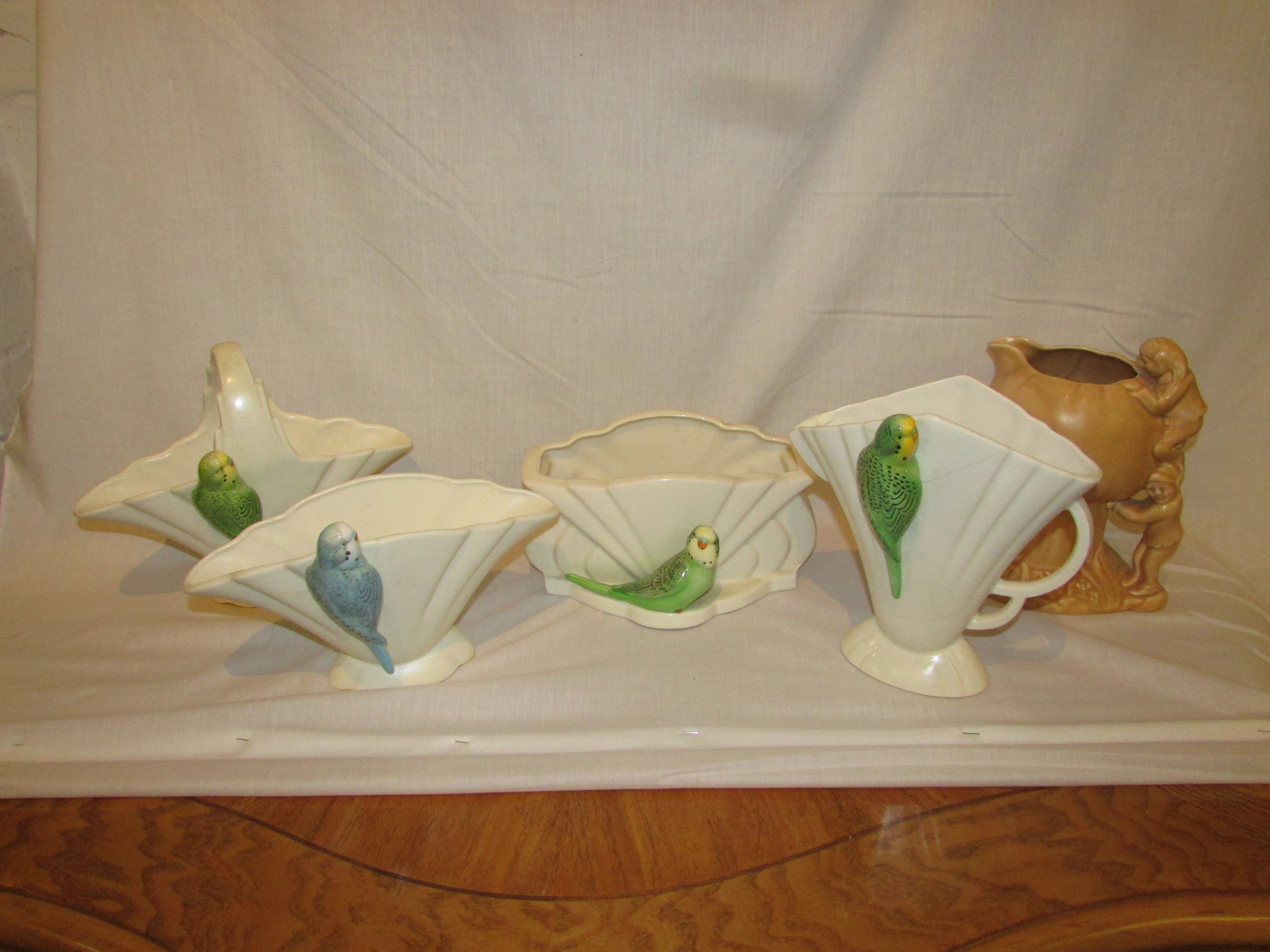 Four Sylvac and Falcon budgerigar vases - Sylvac fan shape green bird, impressed number 548,