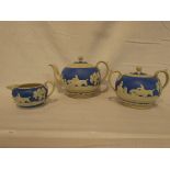 A Copeland late Spode blue ground pate sur pate three-part tea set decorated with hunting scenes,