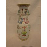 A Chinese porcelain vase enamelled in pale famille rose palette with antiques, objects and