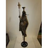 Scrap metal sculpture figure of warrior formed from 7lb pick axe head with mesh robe, shield of