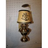 A Kosmos Brenner nautical oil lamp on brass gimbal mount with shade and smoke guard