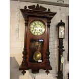 American walnut cased chiming wall clock, the cream enamel dial (diameter 16cm) with Roman chapter