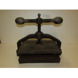 An iron book press marked WARRANTED LONDON MADE (dimensions of plate 25cm x 38cm)