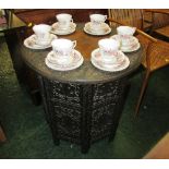 HEAVILY CARVED INLAID CIRCULAR OCCASIONAL TABLE ON FOLDING BASE