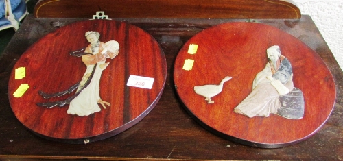 PAIR OF WOOD MOUNTED ORIENTAL WALL PLAQUES DECORATED WITH MAN AND WOMAN