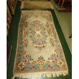 LARGE BEIGE GROUND RECTANGULAR FLOOR RUG WITH FLORAL DESIGN AND TASSELLED ENDS AND MATCHING