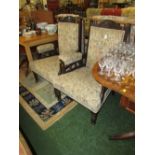 PAIR OF STAINED OAK ARMCHAIRS WITH CARVED DETAIL AND TURNED LEGS AND FLORAL UPHOLSTERED SEAT BACK