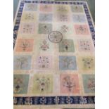 SUBSTANTIAL BEIGE GROUND FLOOR RUG WITH BLUE FLORAL MARGIN AND FLORAL DECORATION