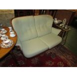 ERCOL MID ELM TWO SEATER SOFA WITH PALE GREEN BUTTON BACK CUSHIONS WITH SPARE SET OF COVERS