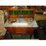 LIGHT MAHOGANY WASHSTAND WITH MARBLE TOP, GREEN TILE SPLASH BACK AND SINGLE CUPBOARD DOOR