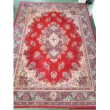 LARGE RED GROUND FLOOR RUG WITH CENTRAL MEDALLION AND FOUR MARGINS