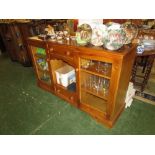 COMPOSITE PINE SIDEBOARD WITH TWO CENTRAL DRAWERS AND RECESS AND SINGLE GLAZED DOOR TO EITHER SIDE