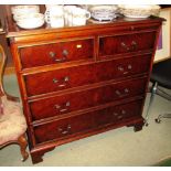 MAHOGANY AND WALNUT VENEERED CHEST OF TWO SHORT OVER THREE LONG DRAWERS WITH BRUSH SLIDE