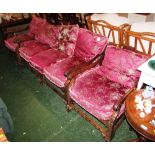 CARVED MID WOOD FRAMED THREE PIECE BERGERE SUITE WITH LOOSE FLORAL PATTERNED CUSHIONS