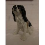 Winstanley seated spaniel in white, black and brown with brown glass eyes, height 27.5cm, marked