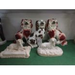 Pair of Rockingham type porcelain seated spaniels (height 14cm), a lustre Staffordshire pottery dog,