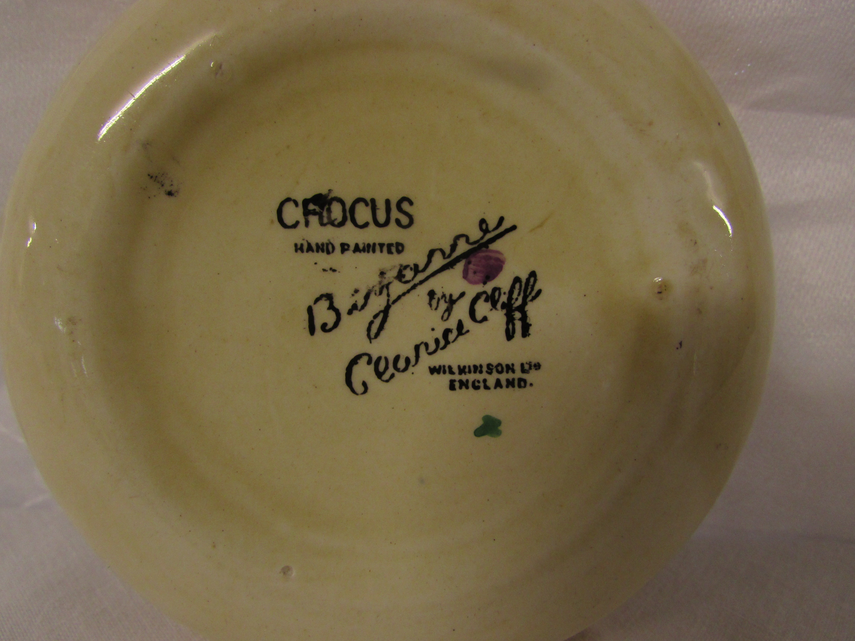 Bizarre by Clarice Cliff crocus circular dish, yellow rim, diameter 9.3cm, black transfer mark to - Image 3 of 3