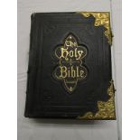 A large Edwardian family Bible with preface by Dr Eadie, coloured pages for family records and Great