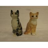 Two Winstanley cats - a seated tortoiseshell with yellow glass eyes, height 20cm, marked MADE IN