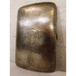 Large silver cigarette case engine turned with granular finish and engraved with monogram,